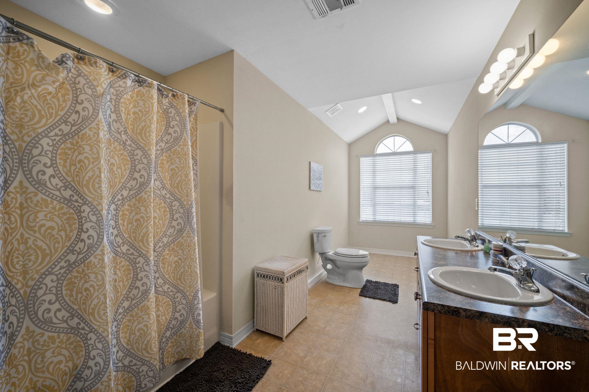 9539 Lakeview Road Bay Minette, AL 36507 - Photo 25 of 45 Bathroom with tile patterned floors, vanity, lofted ceiling with beams, and toilet