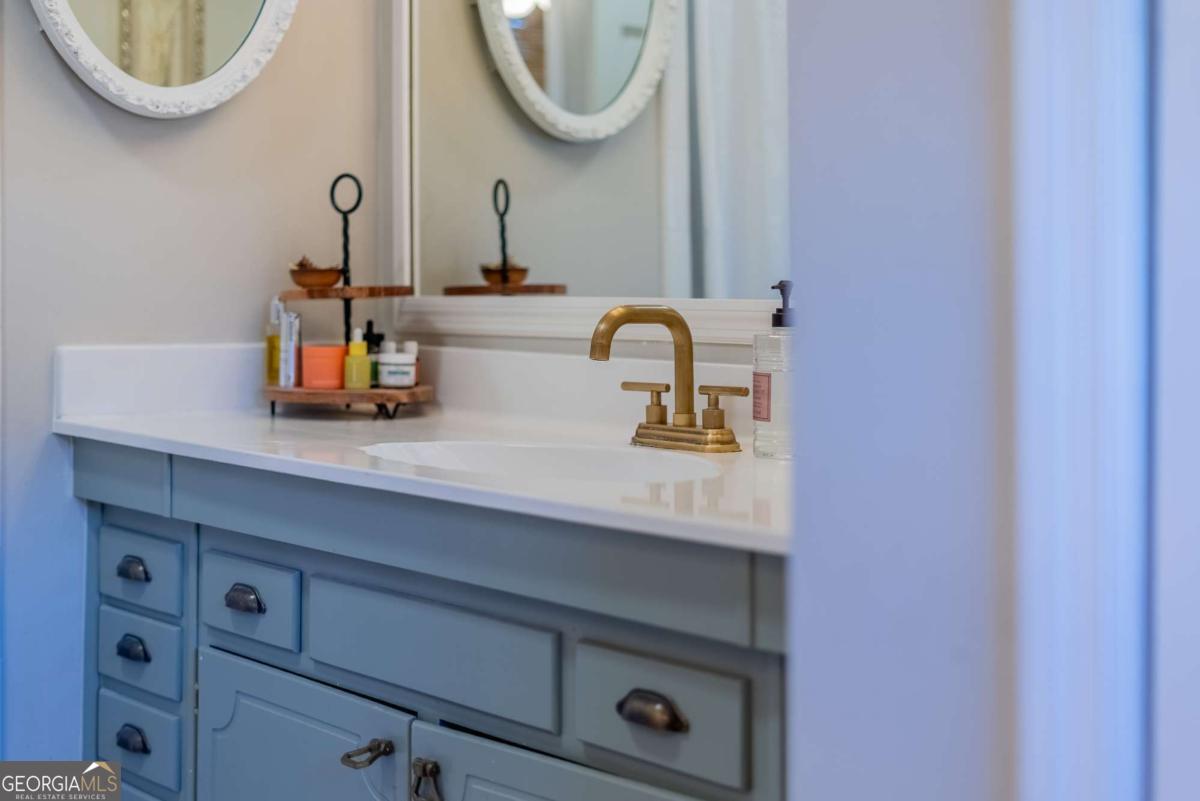 403 Rose Lane Douglas, GA 31533 - Photo 41 of 42 a close view of sink with a mirror