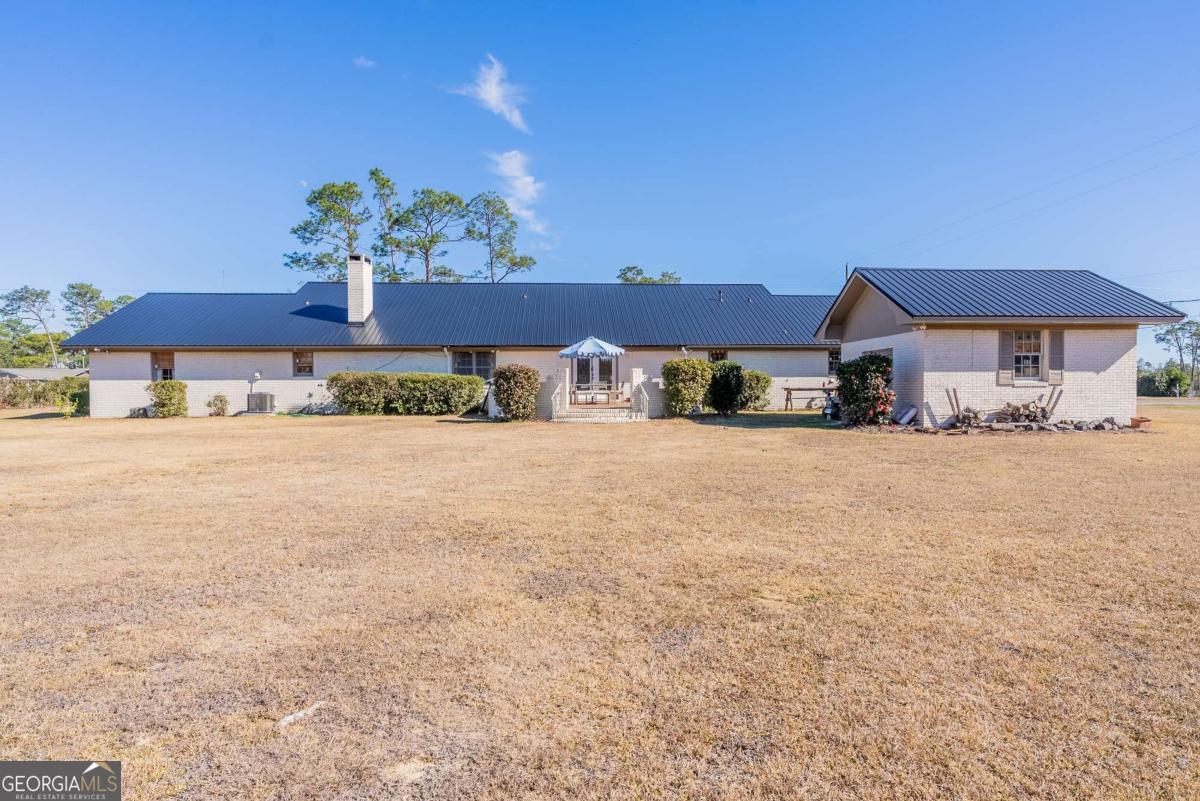 403 Rose Lane Douglas, GA 31533 - Photo 6 of 42 a view of a house with a yard
