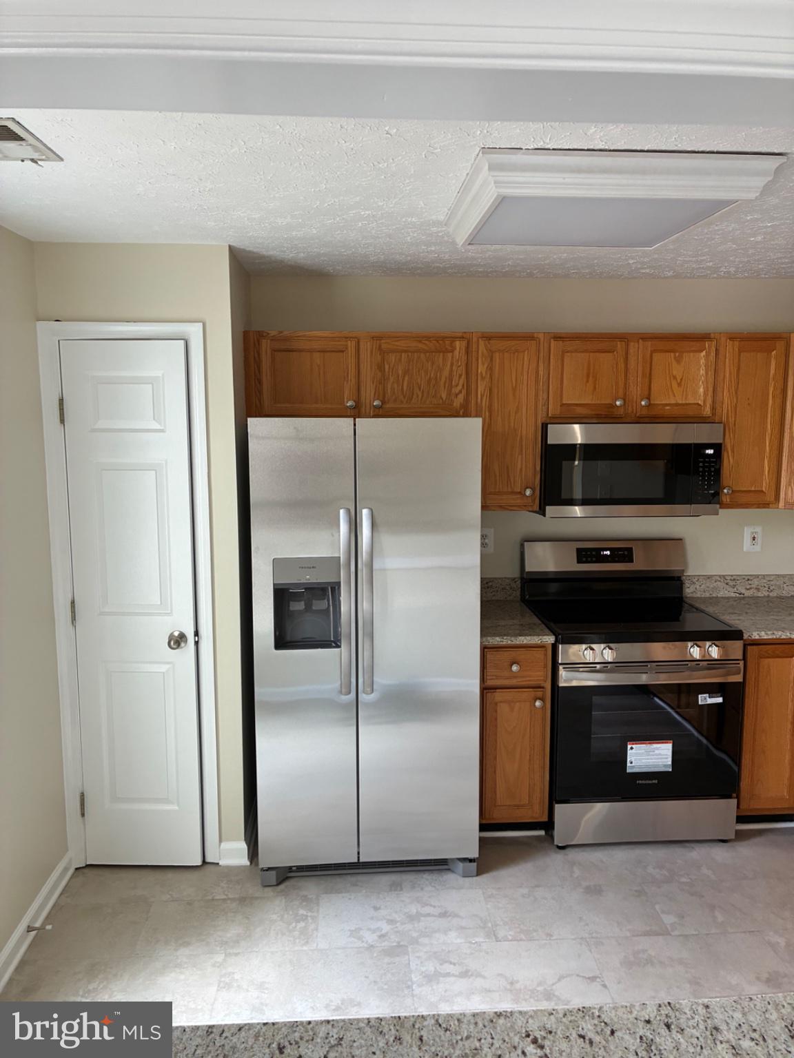 8382 Cypress Mill Road, Unit 8382 Nottingham, MD 21236 - Photo 11 of 12 Modern kitchen with sleek appliances.