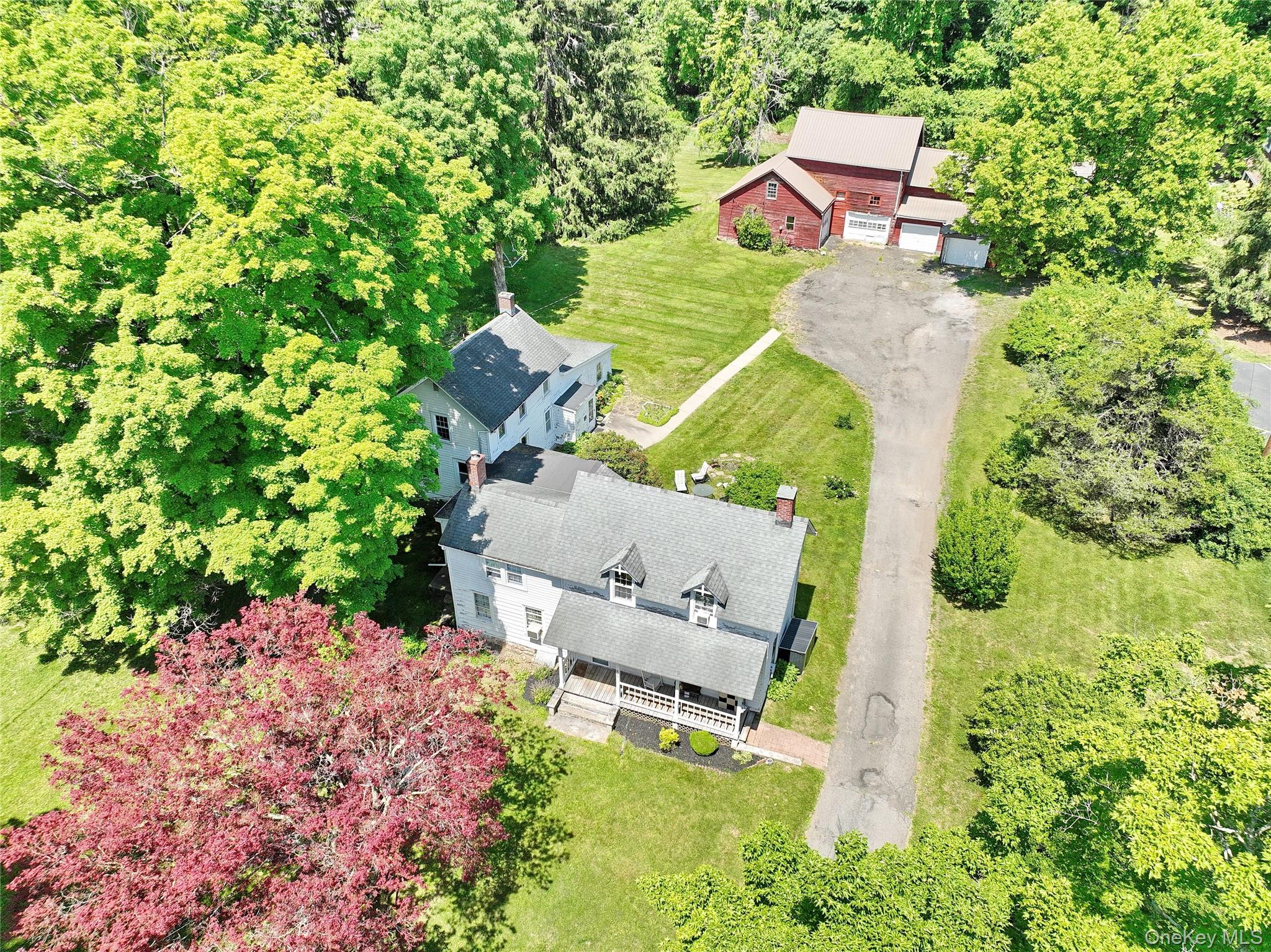 500 Haverstraw Road Suffern, NY 10901 - Photo 1 of 36 an aerial view of a house with a yard and lake view