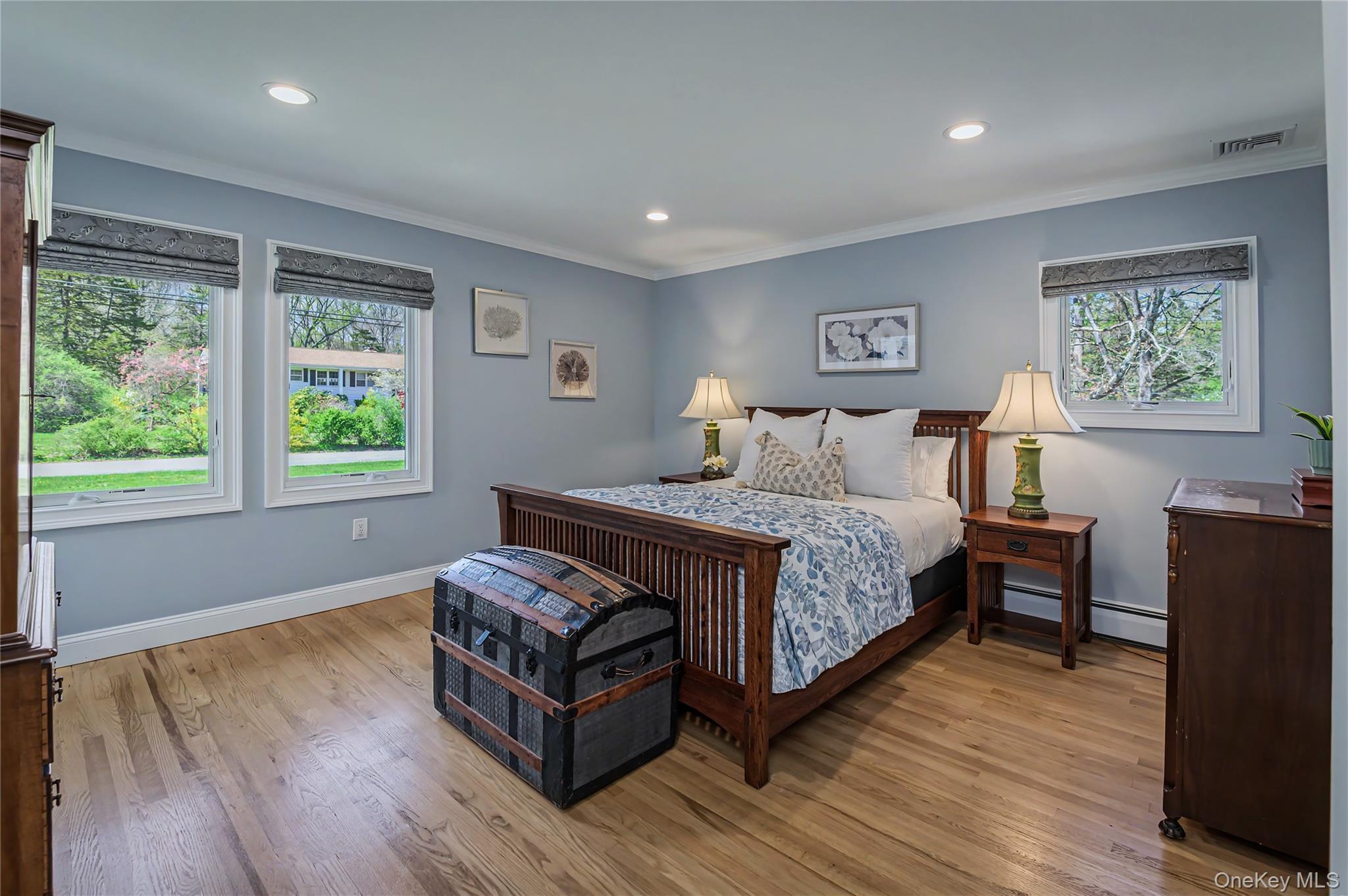 41 Cross Pond Road Pound Ridge, NY 10576 - Photo 22 of 41 a bedroom with a bed and wooden floor