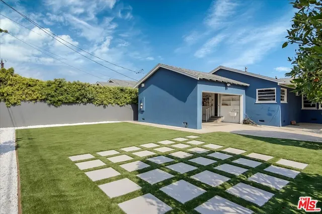 a backyard of a house with a yard