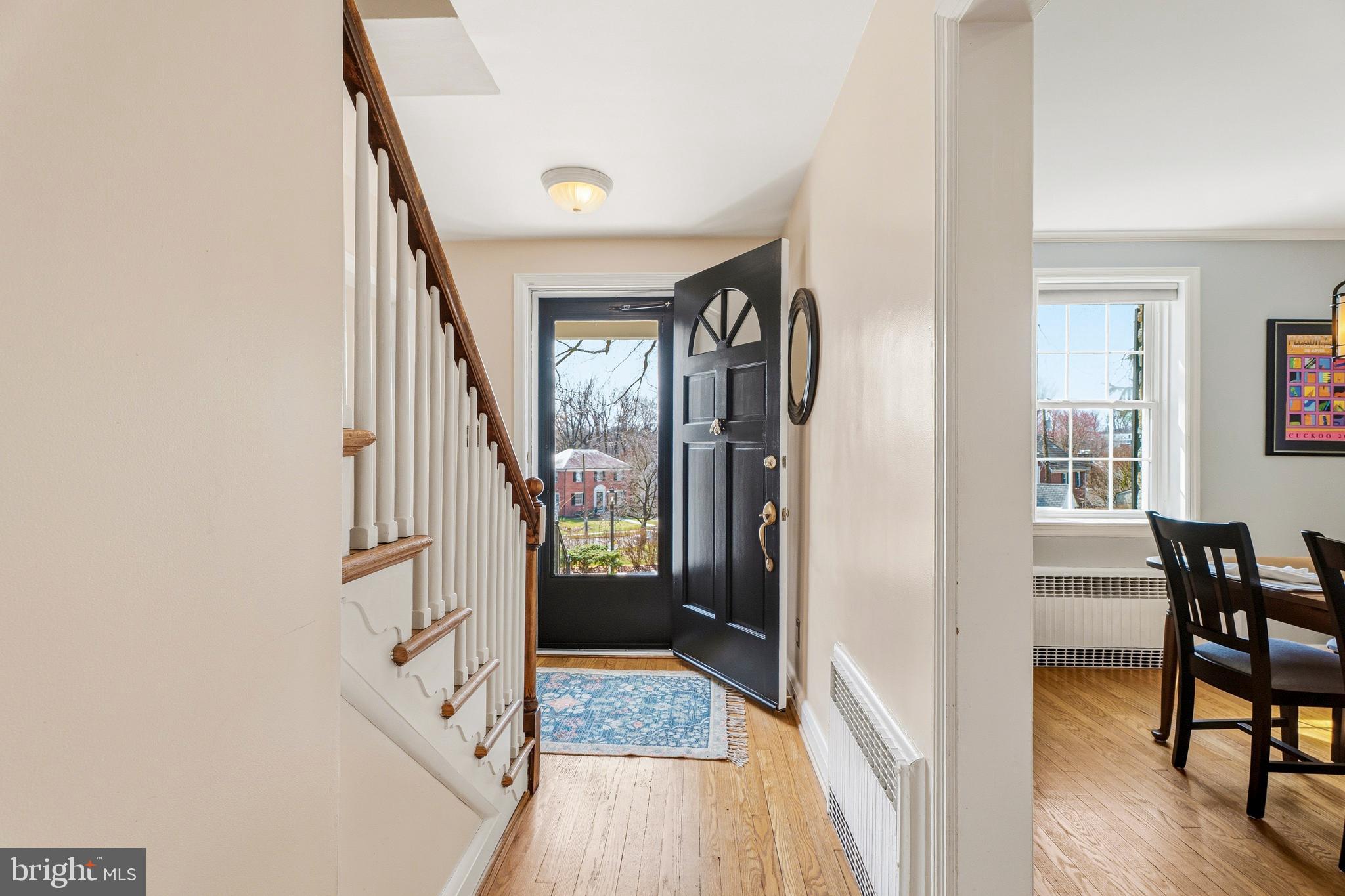 318 Alabama Road Towson, MD 21204 - Photo 10 of 72 a view of a hallway with wooden floor and furniture