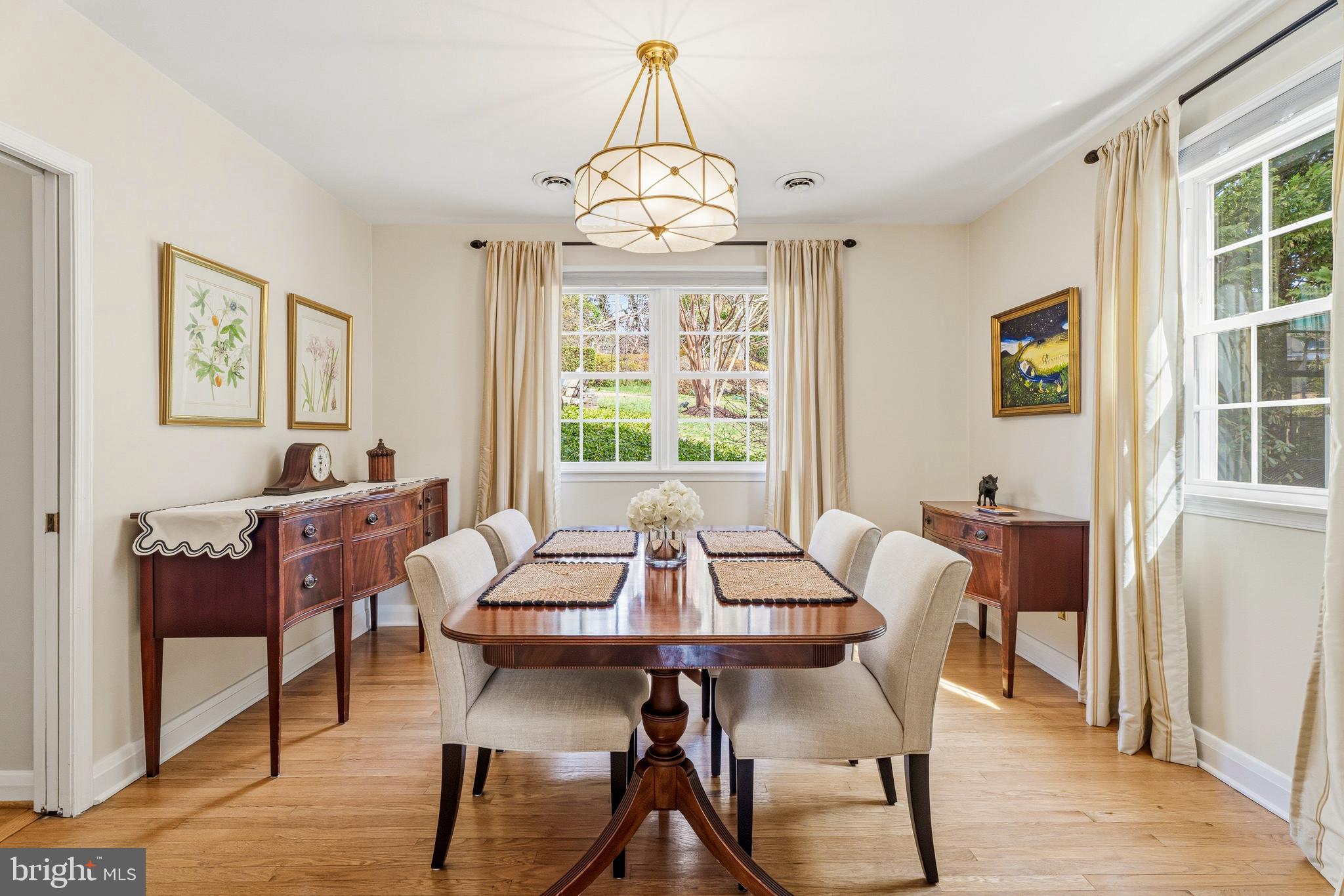 318 Alabama Road Towson, MD 21204 - Photo 14 of 72 a dining room with furniture a chandelier and wooden floor