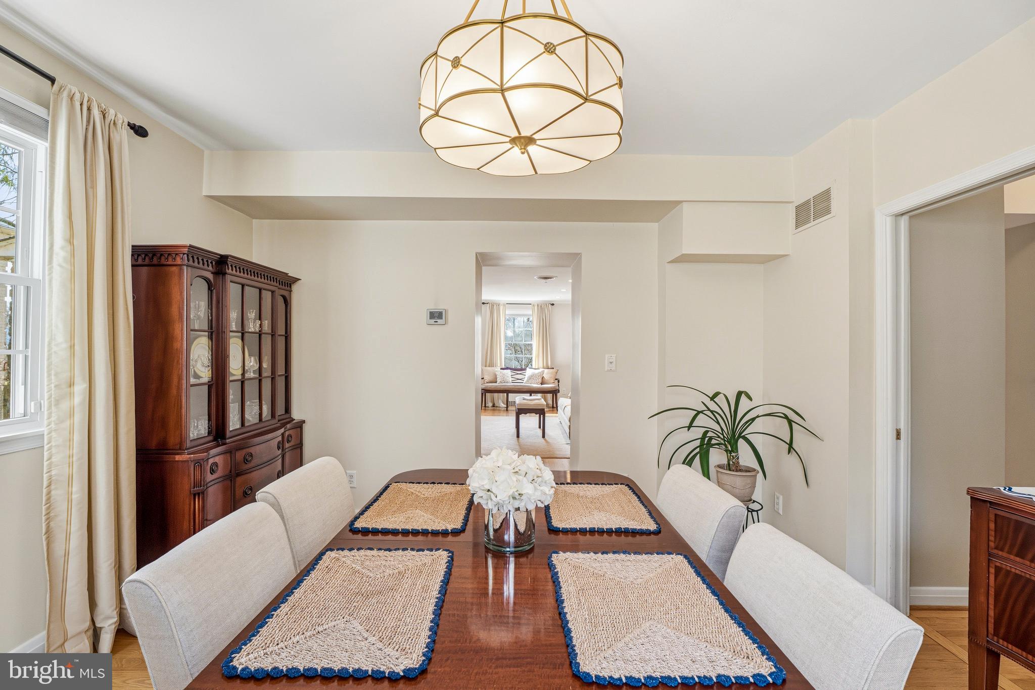 318 Alabama Road Towson, MD 21204 - Photo 15 of 72 a living room with furniture a dining table and a large window