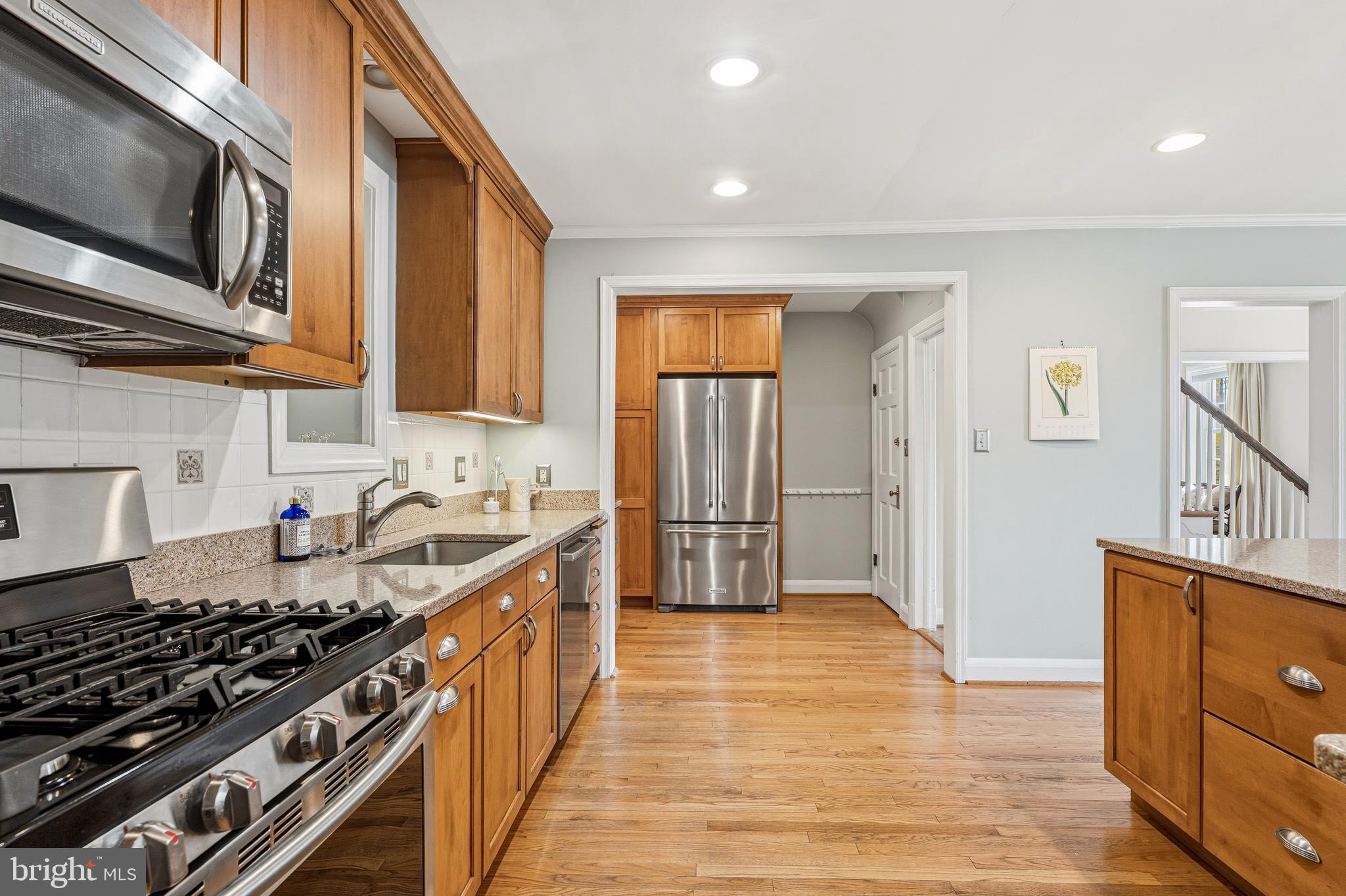 318 Alabama Road Towson, MD 21204 - Photo 20 of 72 a kitchen with stainless steel appliances granite countertop a stove and a sink