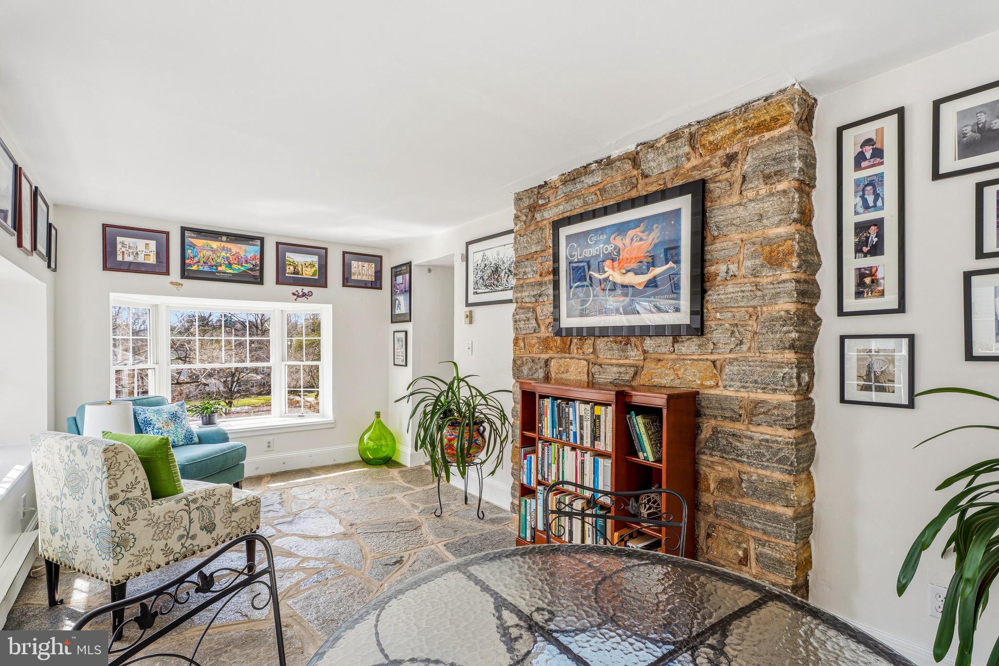 318 Alabama Road Towson, MD 21204 - Photo 27 of 72 a living room with furniture and a bookshelf with wooden floor