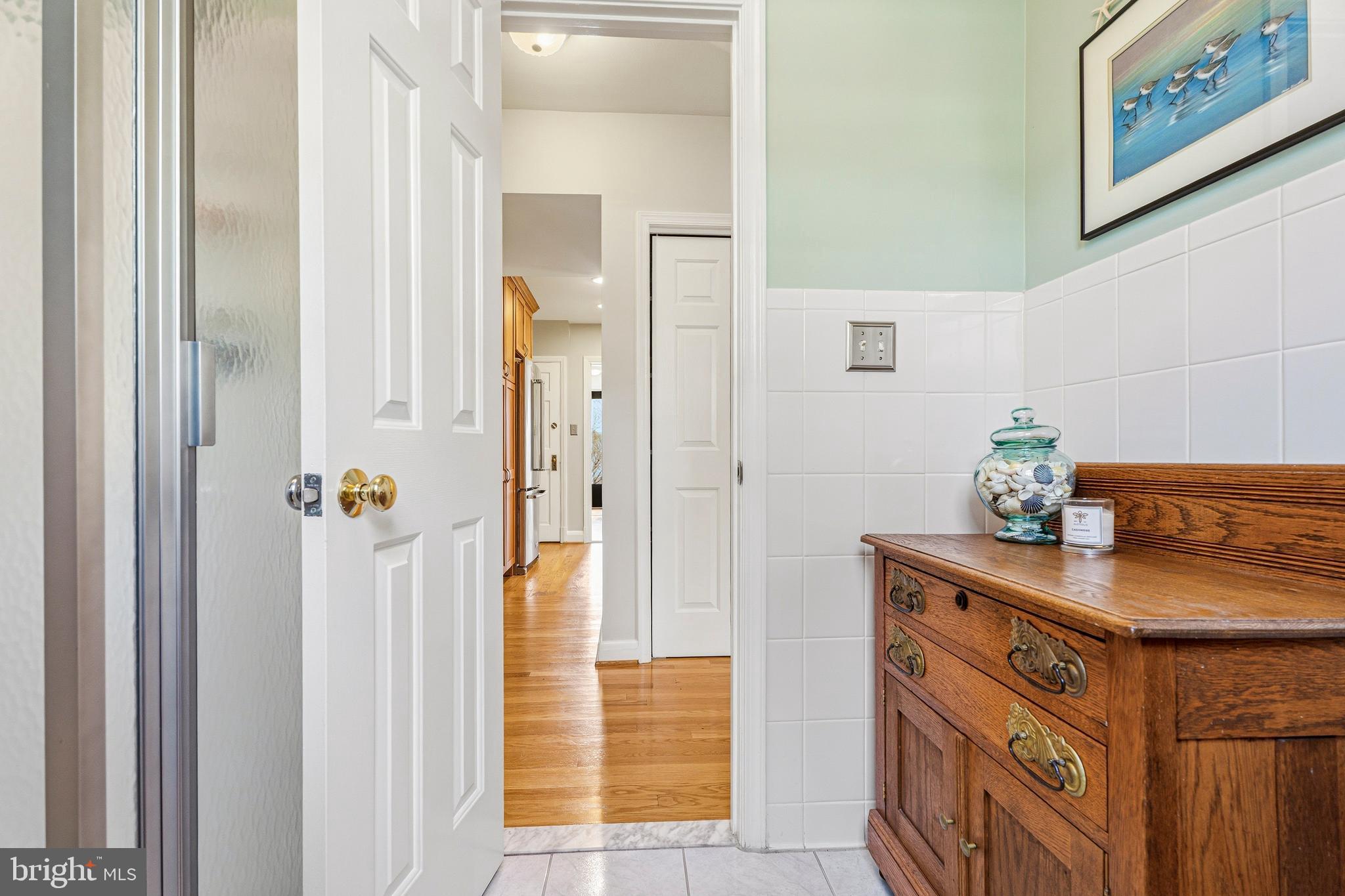 318 Alabama Road Towson, MD 21204 - Photo 29 of 72 a bathroom with a sink a mirror and a shower