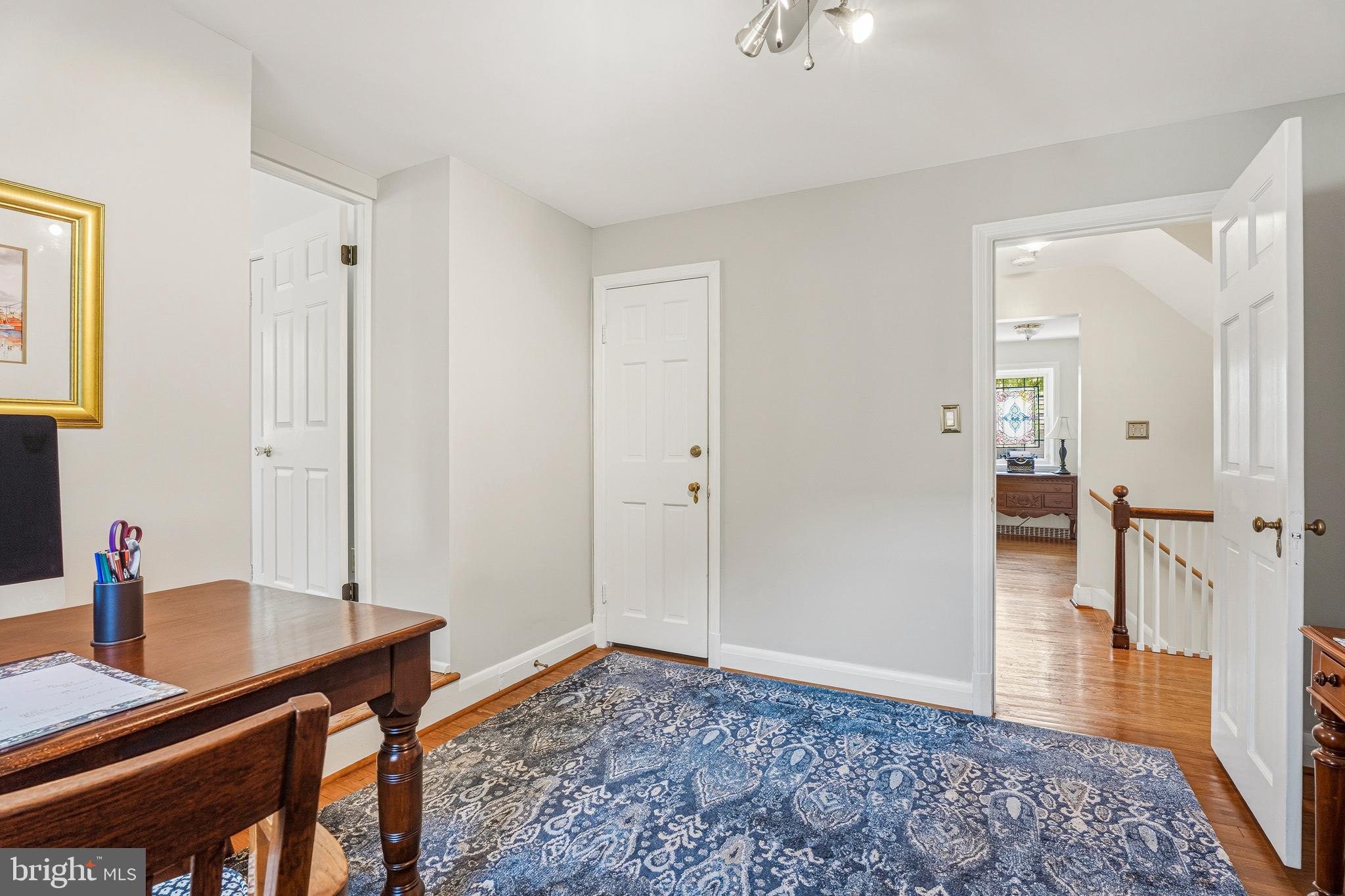 318 Alabama Road Towson, MD 21204 - Photo 35 of 72 a view of a workspace with furniture and wooden floor