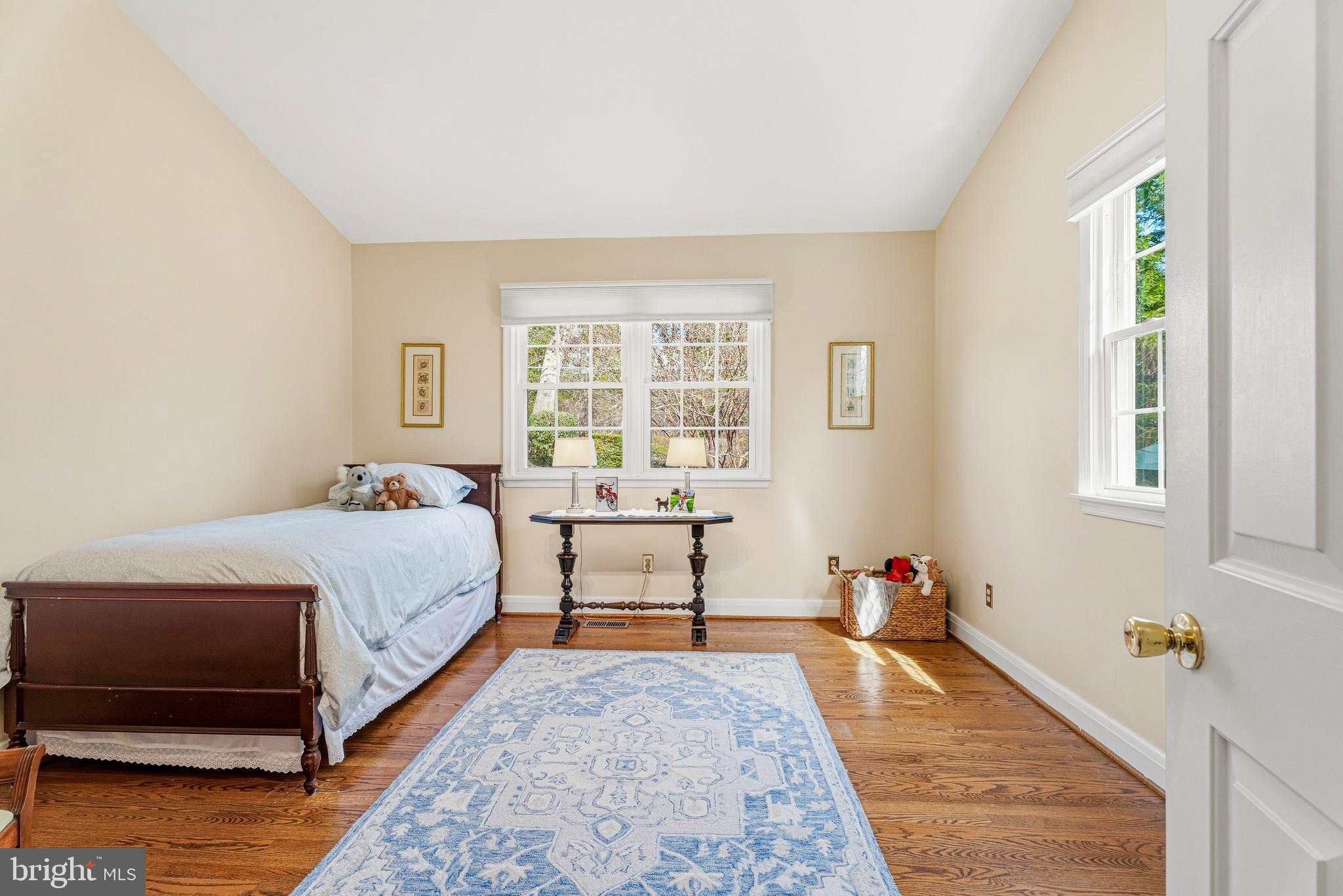 318 Alabama Road Towson, MD 21204 - Photo 43 of 72 a spacious bedroom with a bed and wooden floor