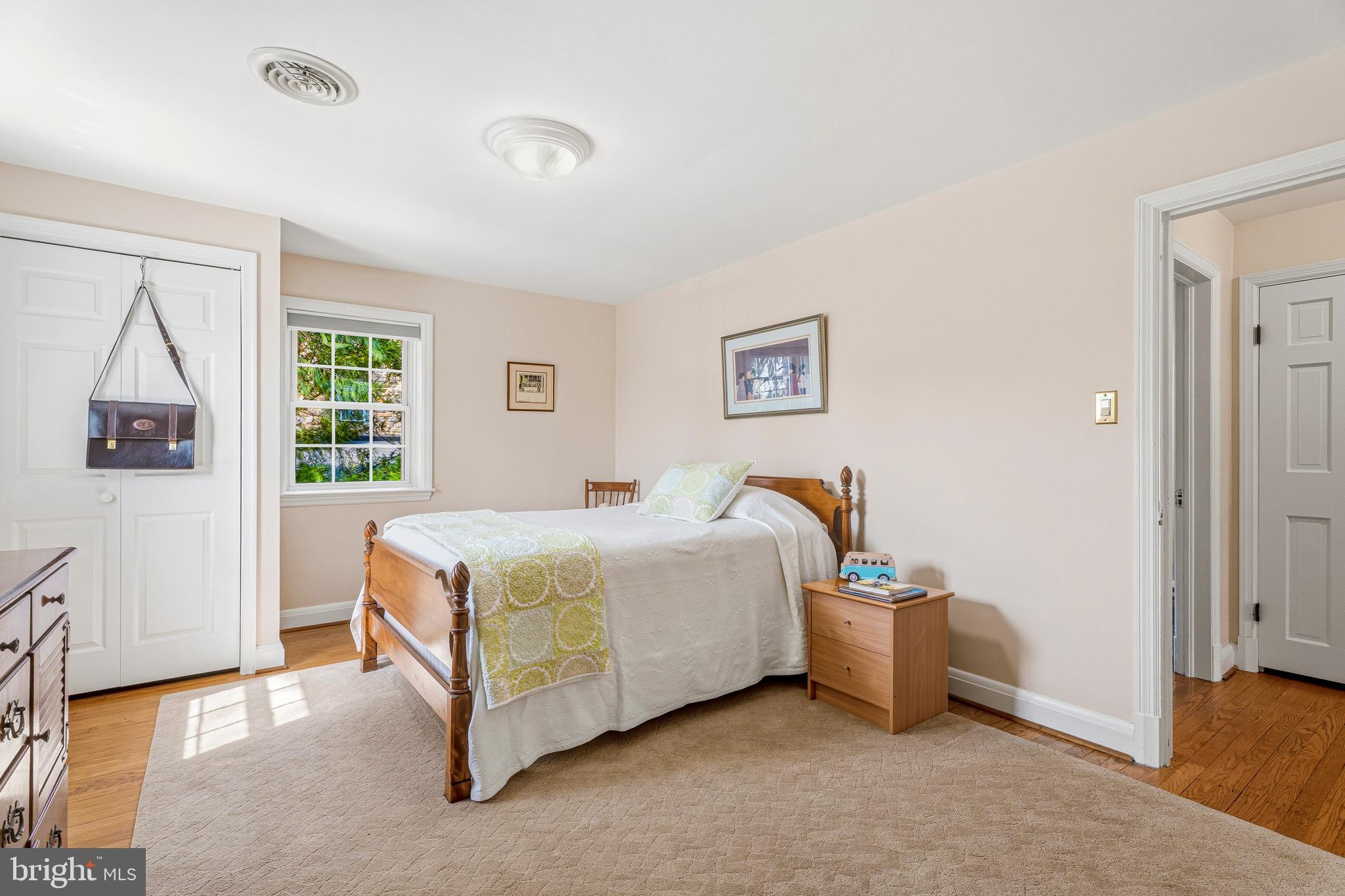 318 Alabama Road Towson, MD 21204 - Photo 49 of 72 a bedroom with a bed a table and painting