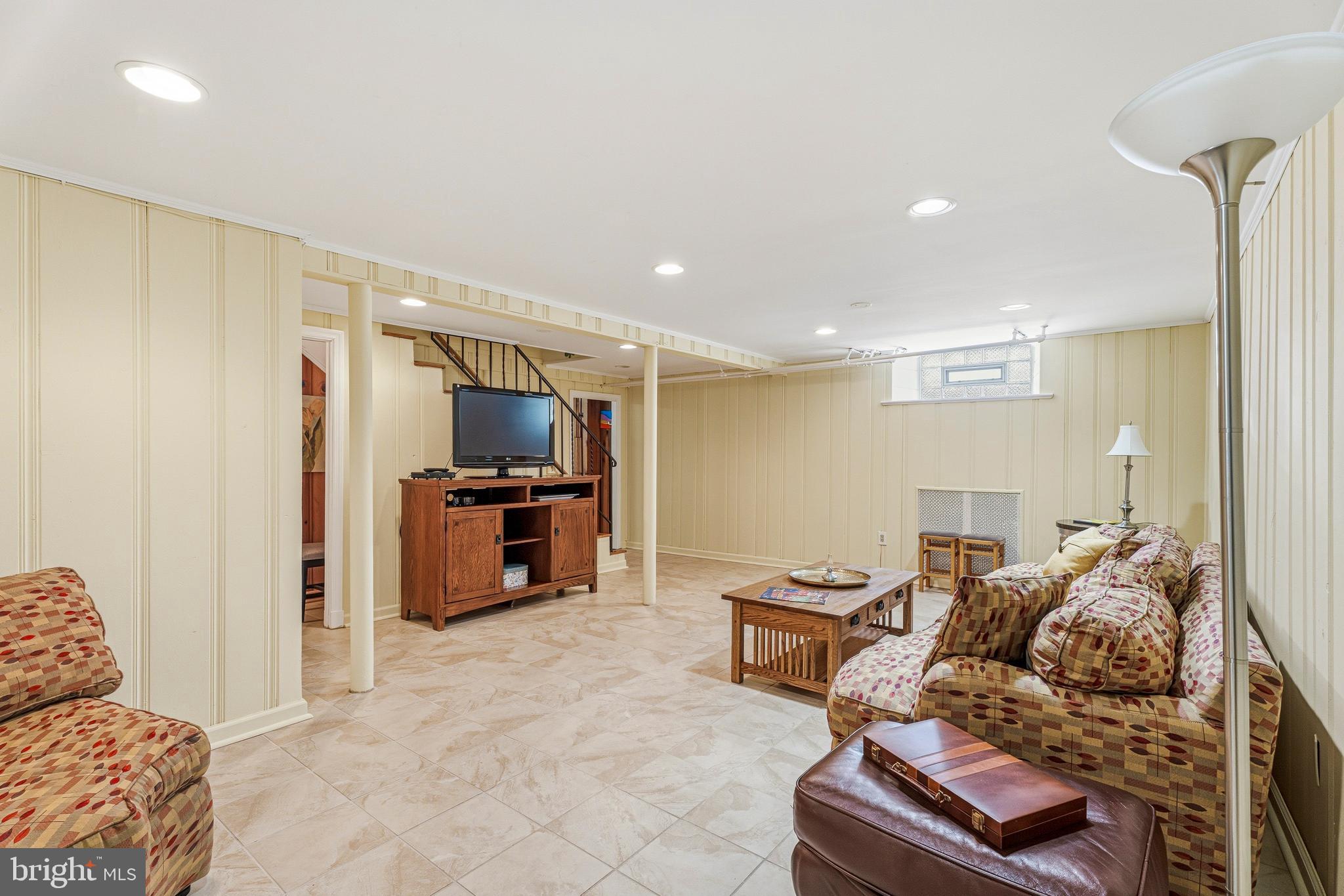 318 Alabama Road Towson, MD 21204 - Photo 56 of 72 a living room with furniture and a flat screen tv