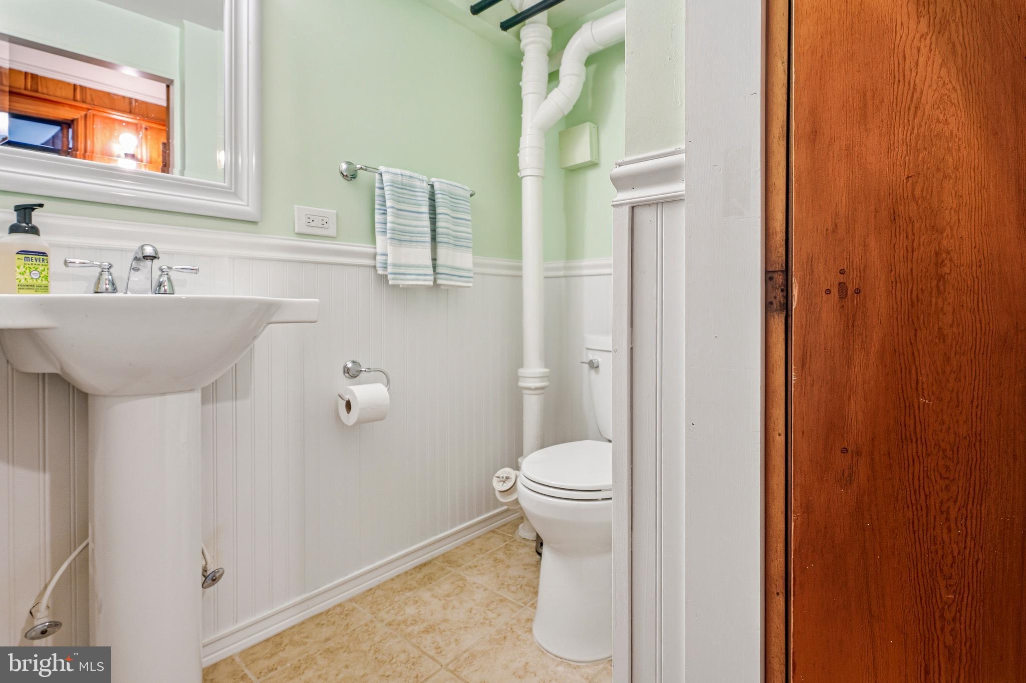 318 Alabama Road Towson, MD 21204 - Photo 57 of 72 a bathroom with a sink and a toilet