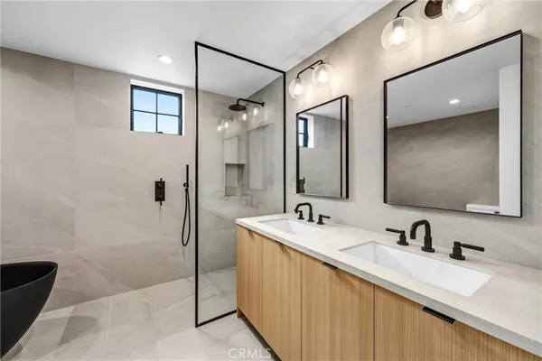 a bathroom with a sink a bathtub and a shower