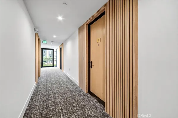 a large kitchen with stainless steel appliances granite countertop a stove a sink and a refrigerator
