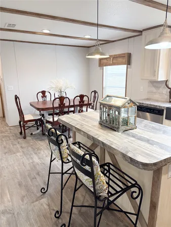 a very nice looking dining room with furniture