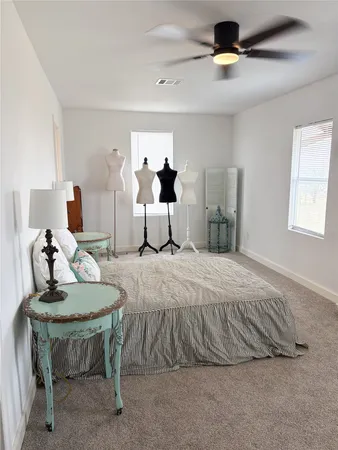 a bedroom with a bed and window