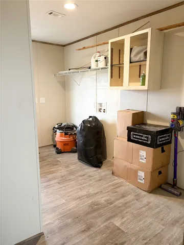 a bedroom with a bed and a cabinets