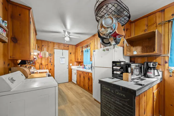 a kitchen with stainless steel appliances granite countertop a stove and a sink