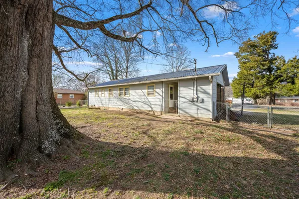 a view of back yard of a house