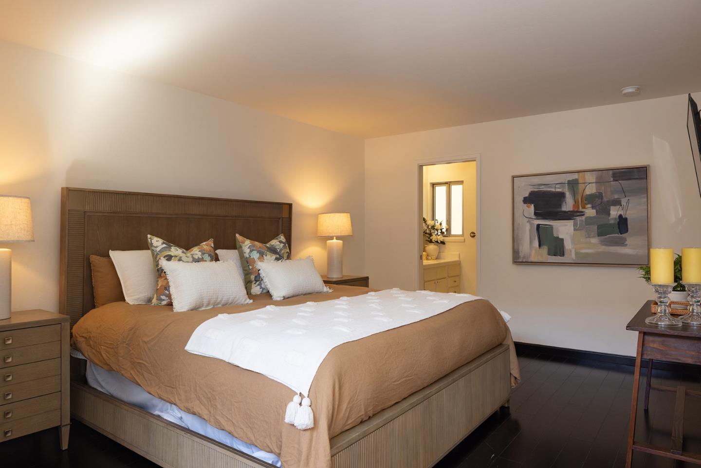 0 Carpenter & 2nd Nw Corner Carmel, CA 93921 - Photo 13 of 23 a bedroom with a bed and paintings on the wall