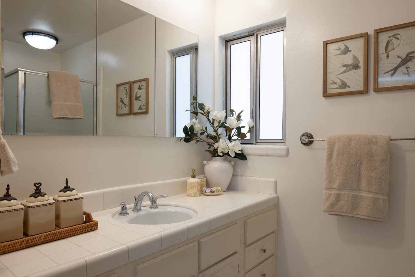0 Carpenter & 2nd Nw Corner Carmel, CA 93921 - Photo 14 of 23 a bathroom with a double vanity sink and a mirror