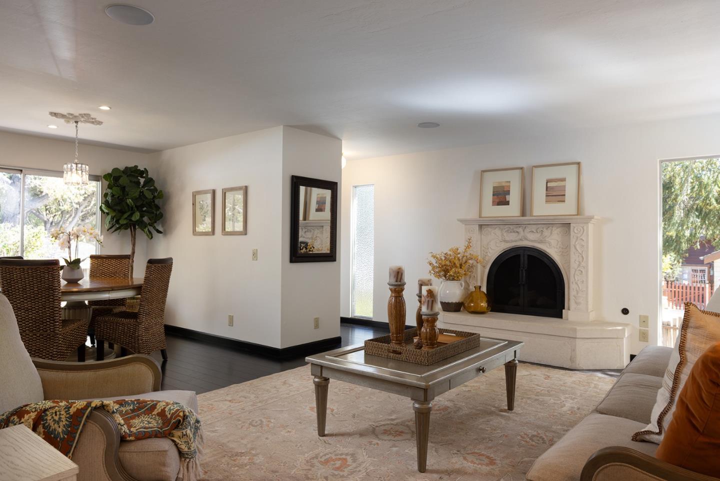 0 Carpenter & 2nd Nw Corner Carmel, CA 93921 - Photo 6 of 23 a living room with furniture a table and a fireplace