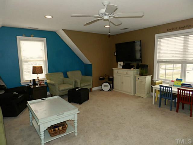 343 Ina Joe Place Willow Spring, NC 27592 - Photo 17 of 23 a living room with furniture and a flat screen tv