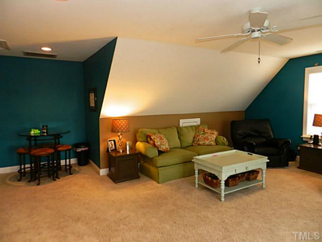 343 Ina Joe Place Willow Spring, NC 27592 - Photo 18 of 23 a living room with furniture and a flat screen tv