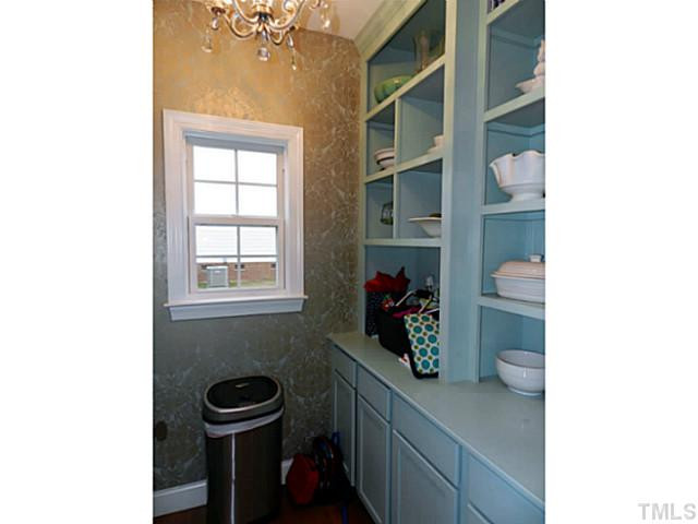 343 Ina Joe Place Willow Spring, NC 27592 - Photo 10 of 23 a bathroom with a sink and a mirror