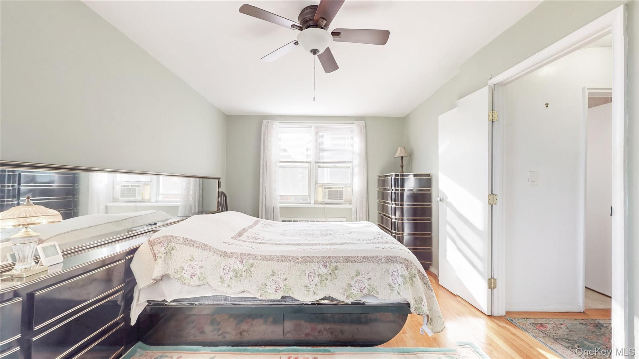 67-40 Booth Street, Unit 4O Queens, NY 11375 - Photo 14 of 19 a bedroom with a bed and a window