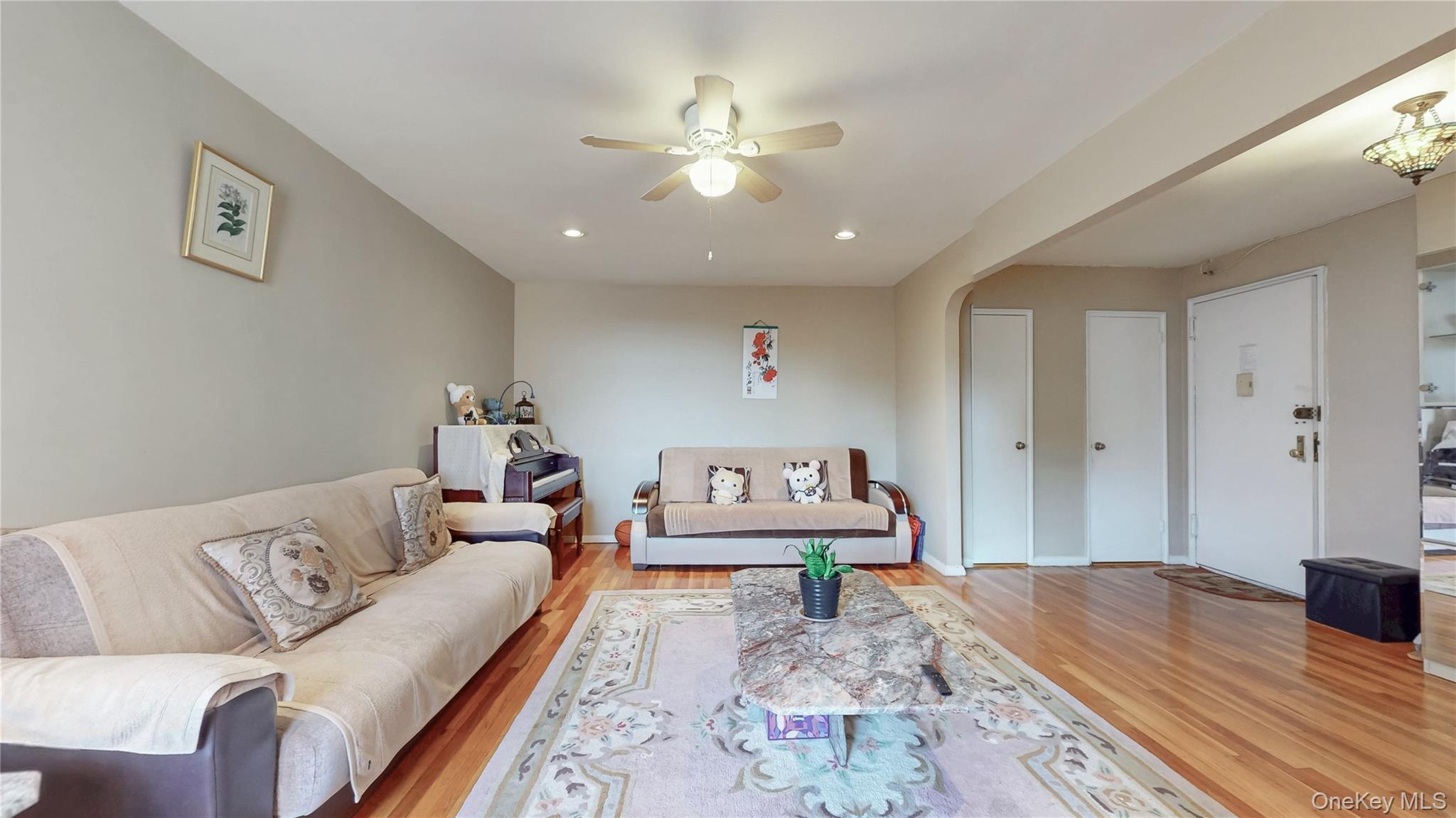 67-40 Booth Street, Unit 4O Queens, NY 11375 - Photo 7 of 19 a living room with furniture and wooden floor