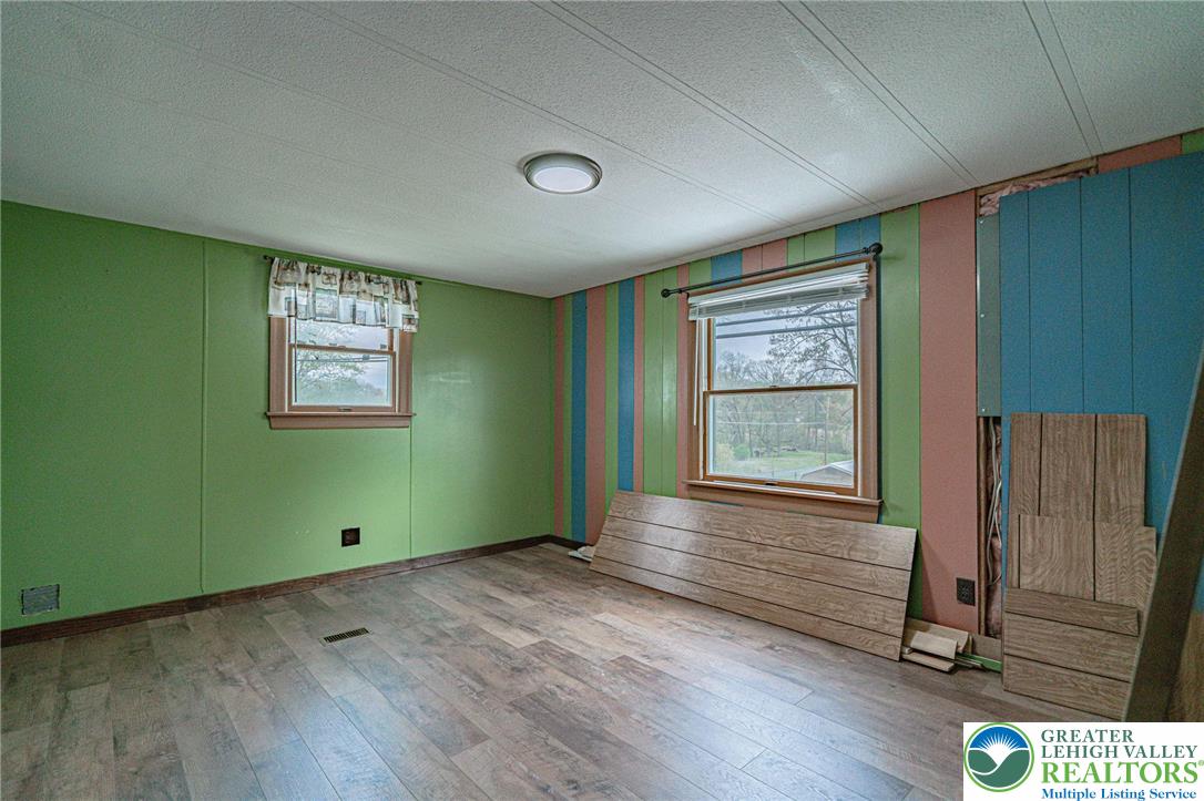 3310 Friedens Road Slatington, PA 18080 - Photo 15 of 41 an empty room with wooden floor closet and windows
