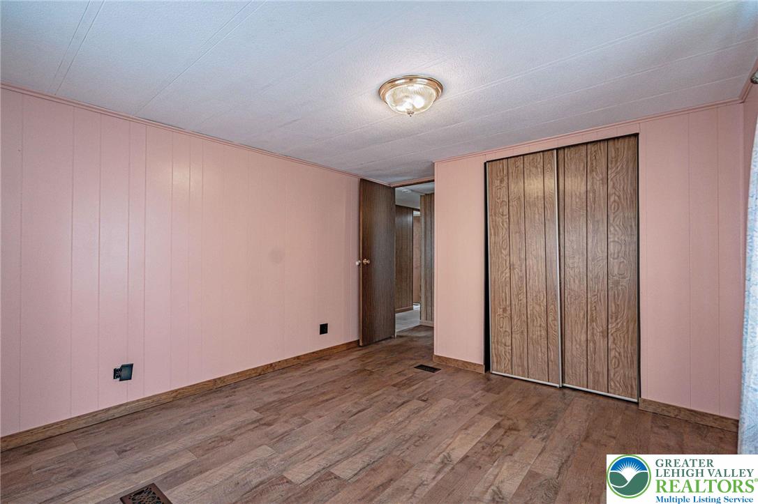 3310 Friedens Road Slatington, PA 18080 - Photo 18 of 41 an empty room with wooden floor and windows
