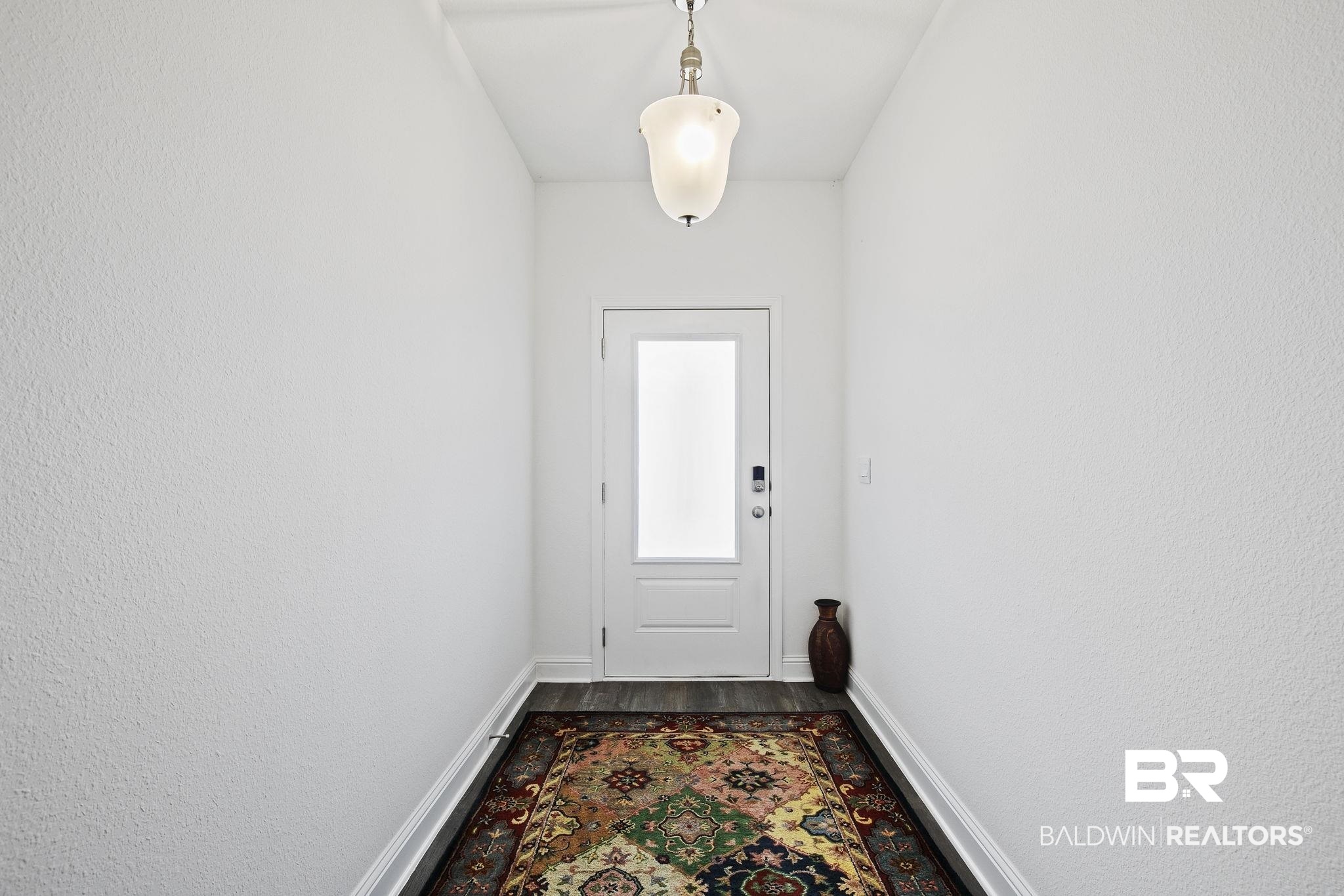 1141 Pencarro Boulevard Foley, AL 36535 - Photo 8 of 70 Doorway featuring wood-type flooring