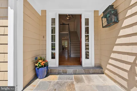 front view of a house with a potted plant