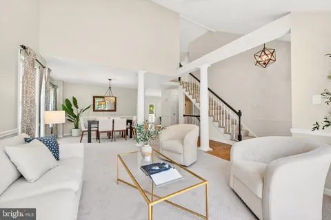 a living room with furniture and a table