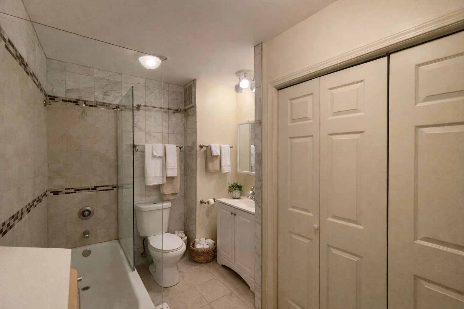 260 East Chestnut Street, Unit 606 Chicago, IL 60611 - Photo 14 of 26 a bathroom with a granite countertop sink toilet and shower