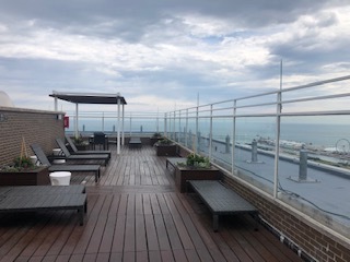 260 East Chestnut Street, Unit 606 Chicago, IL 60611 - Photo 19 of 27 a view of balcony with seating space and wooden floor