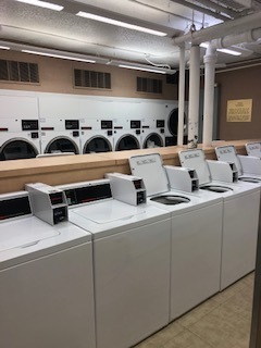 260 East Chestnut Street, Unit 606 Chicago, IL 60611 - Photo 27 of 27 a hallway with white cabinets and sink