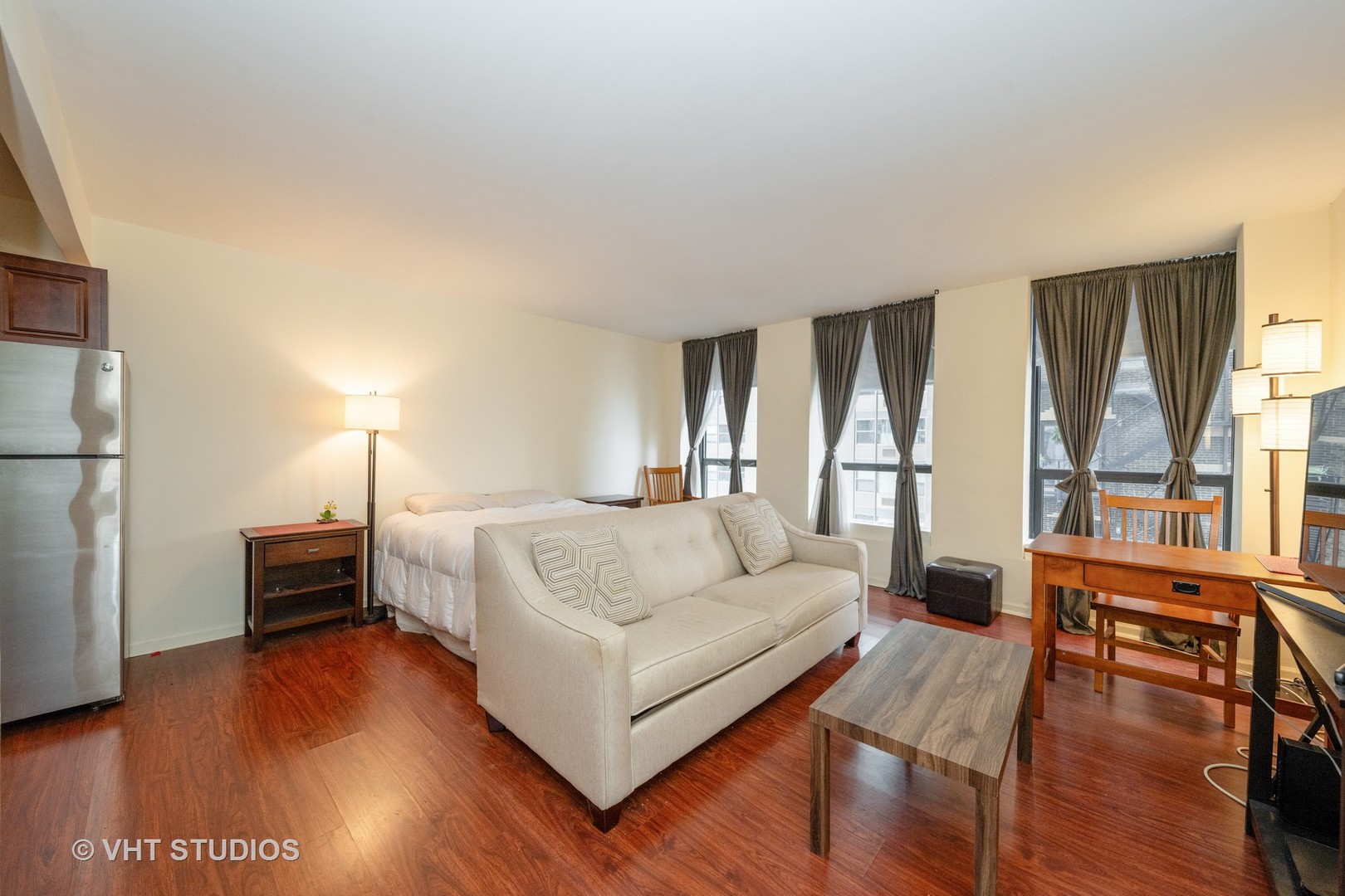 260 East Chestnut Street, Unit 606 Chicago, IL 60611 - Photo 6 of 27 a living room with furniture and a wooden floor