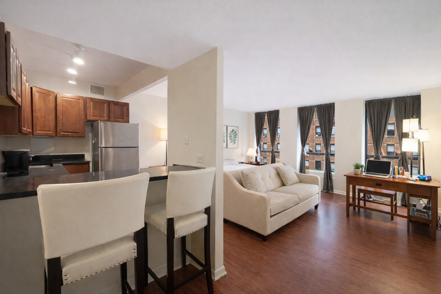 260 East Chestnut Street, Unit 606 Chicago, IL 60611 - Photo 7 of 26 a living room with furniture and a kitchen view