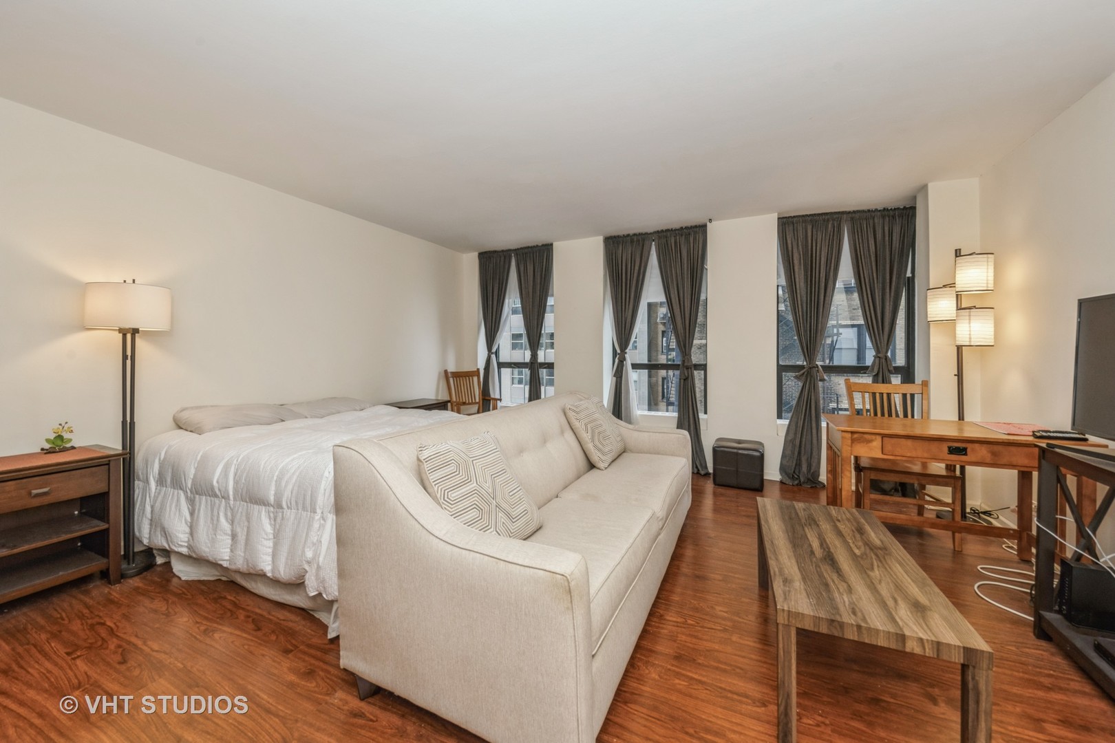 260 East Chestnut Street, Unit 606 Chicago, IL 60611 - Photo 10 of 27 a bed room with a bed and a table