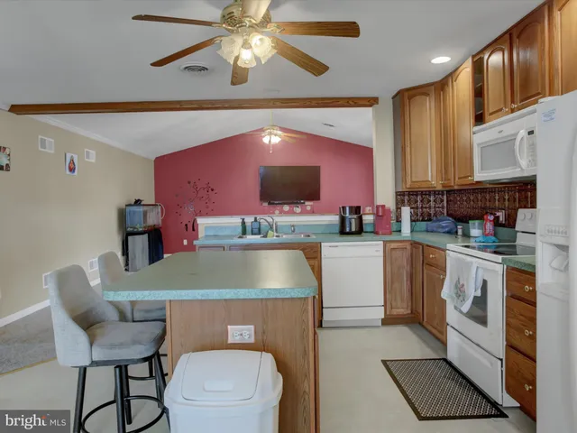 a kitchen with a sink cabinets and appliances