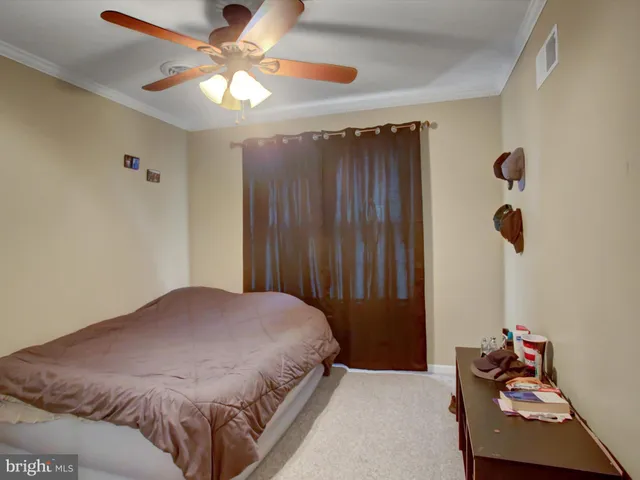 a bedroom with a bed and a cabinets