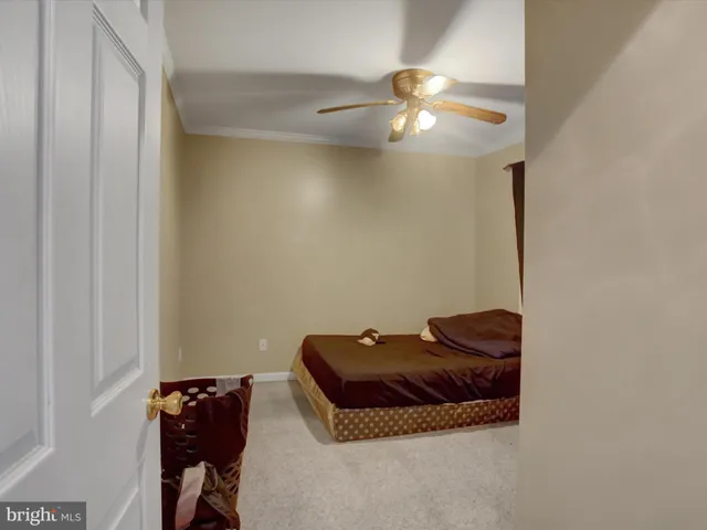 a bedroom with bed and window