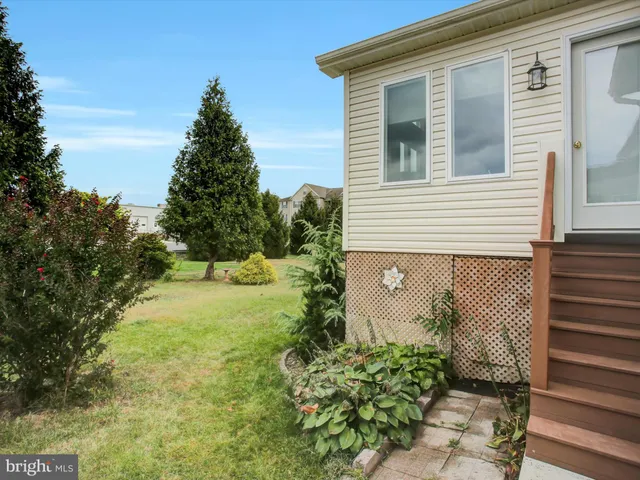 a view of a lake with a yard