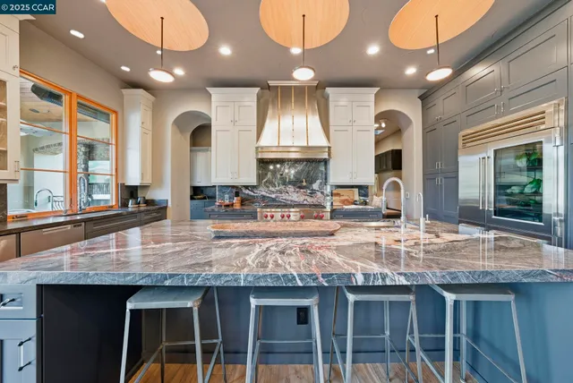 a living room with furniture and a entryway