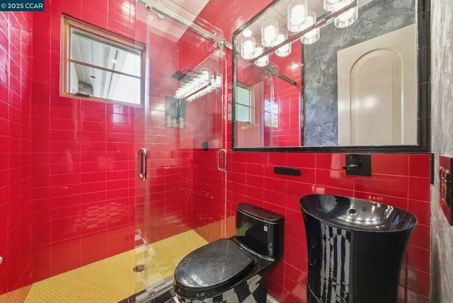 a utility room with cabinets washer and dryer